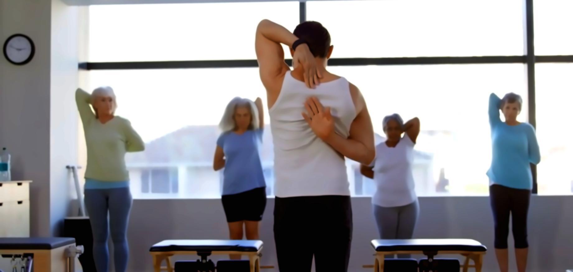 Students collaborating on test case documentation with laptops and notebooks in a modern learning environment